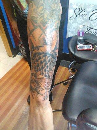 Skin Graphics Tattoos & Body Piercing
